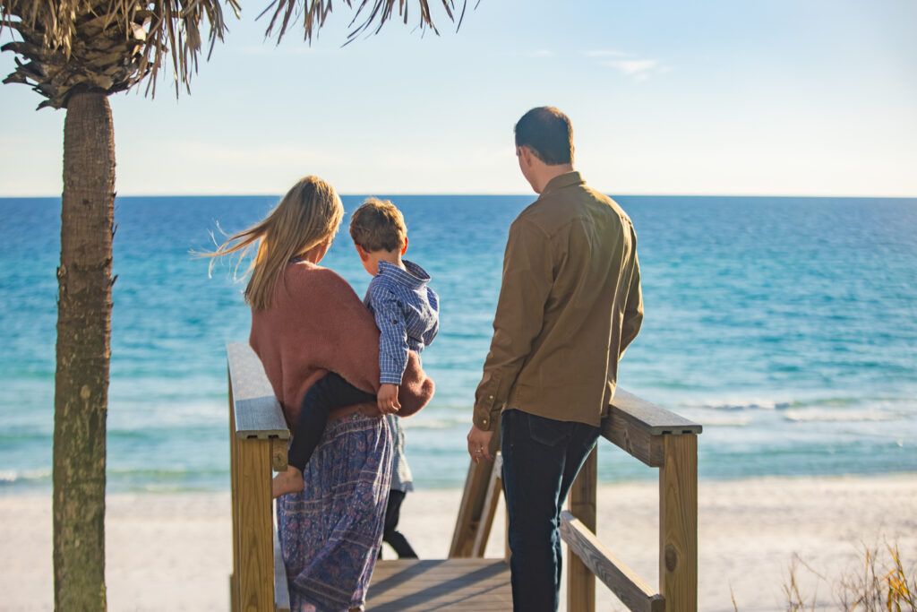 Lifestyle photography of a family overlooking the beach